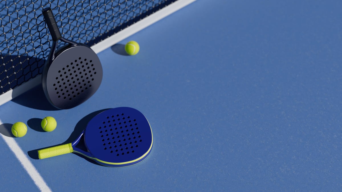 Padel equipment on blue court