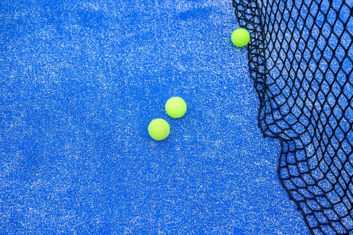 Padel equipment on blue court